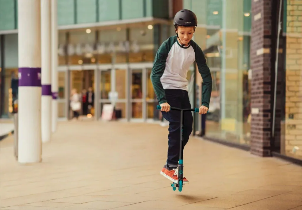STUNTSCOOTER GS 540   Freestyle Kickroller, 100 mm, ABEC 7, verstärkter Lenker, 360°- Lenkung, schwarz-türkis