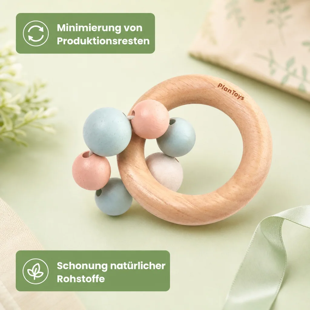Plan Toys Baby Rassel mit Perlenring Holz pastell